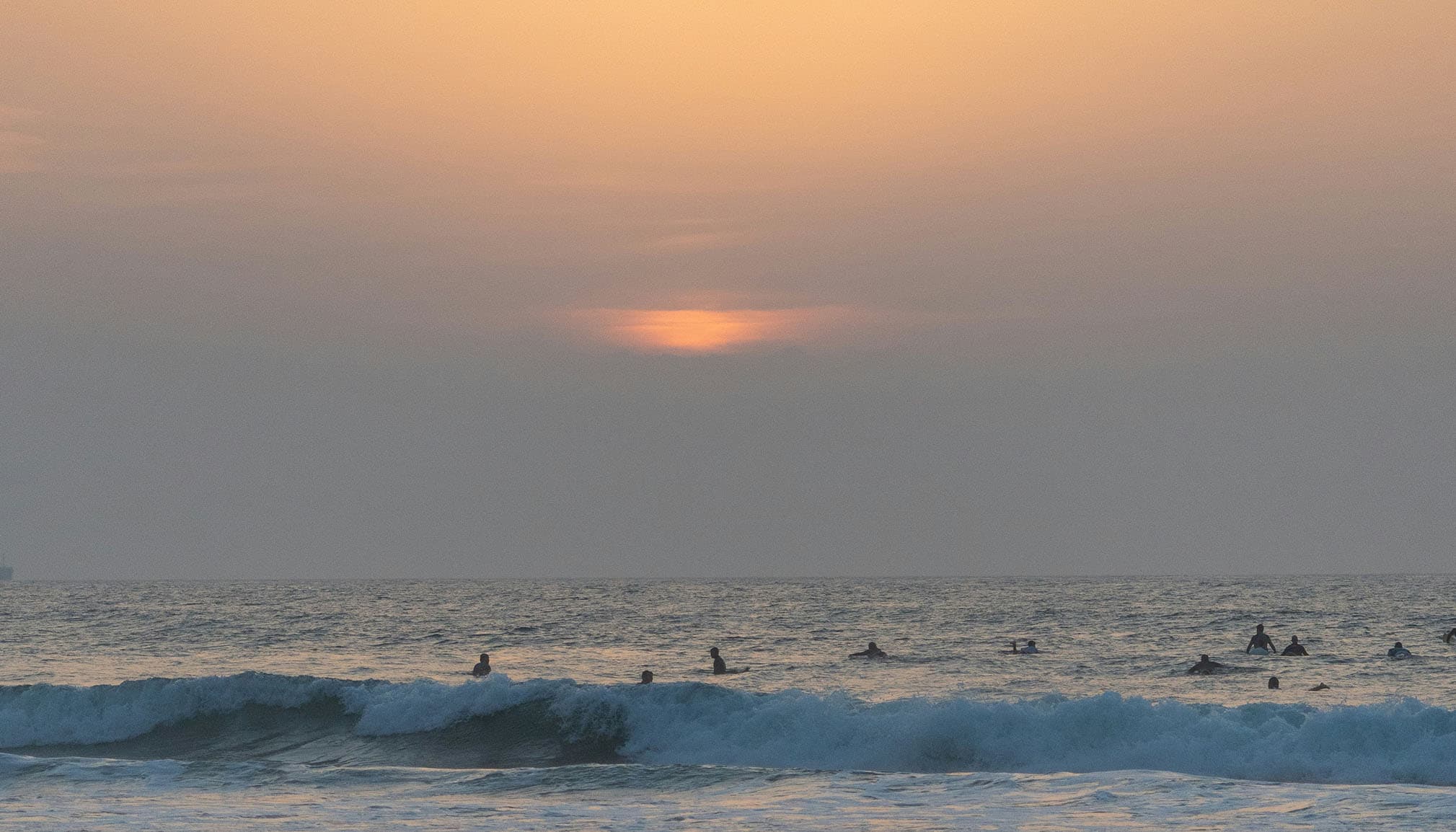 Surfers in water in Goa, India